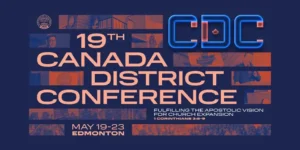 A large congregation of PMCC (4th Watch) members at the 19th Canada District Conference, with Apostle Jonathan S. Ferriol preaching on stage, delegates engaged in worship and prayer, and church leaders from around the world present.